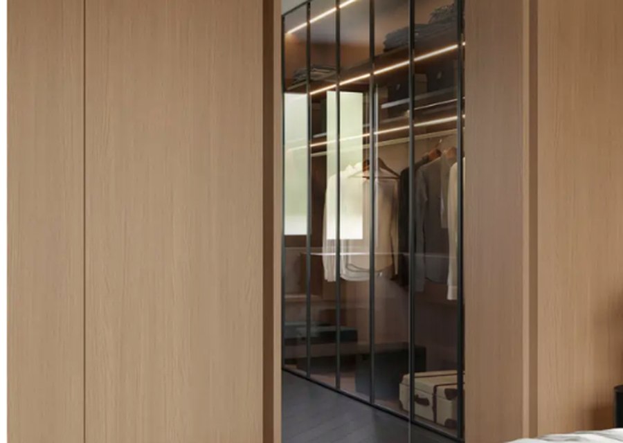 Wardrobe space with natural wood finish